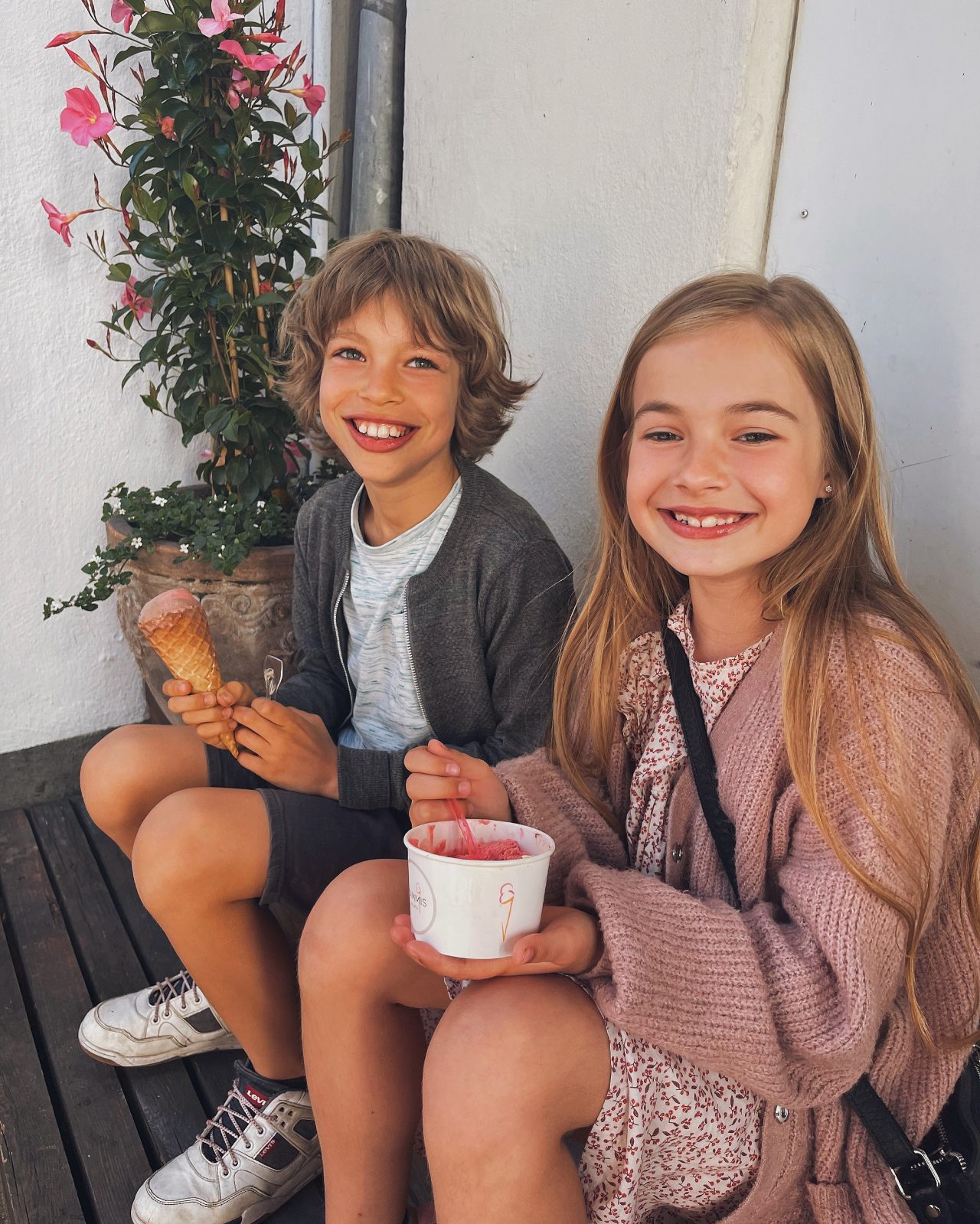 boy and girl eating icecream and smiling